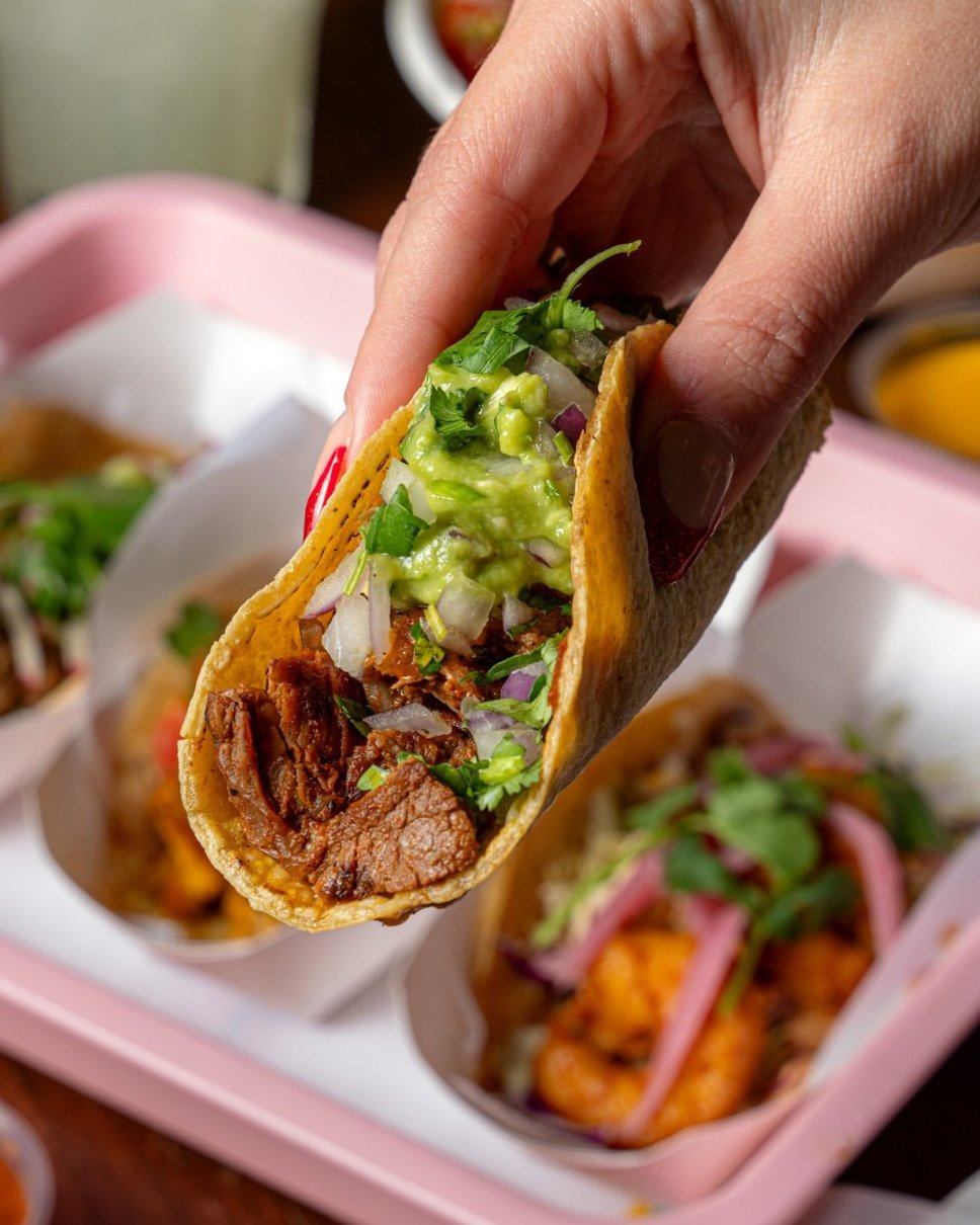 A carne asada taco on a hand-pressed corn tortilla with avocado salsa, onion and cilantro · 📸 PHOTO VIA @CHICASTACOS