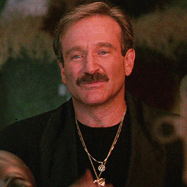 Robin Williams blowing a kiss