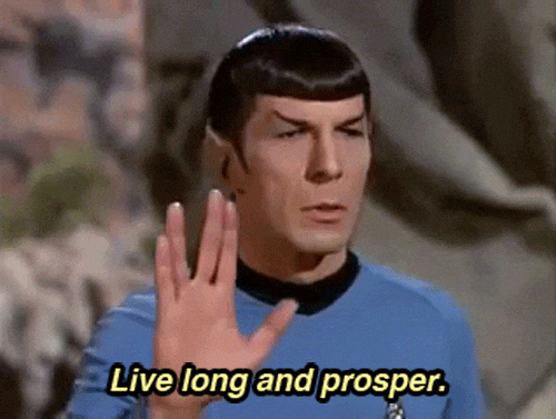 Spock raises his hand in a Vulcan salute as "Live long and prosper." appears on screen.