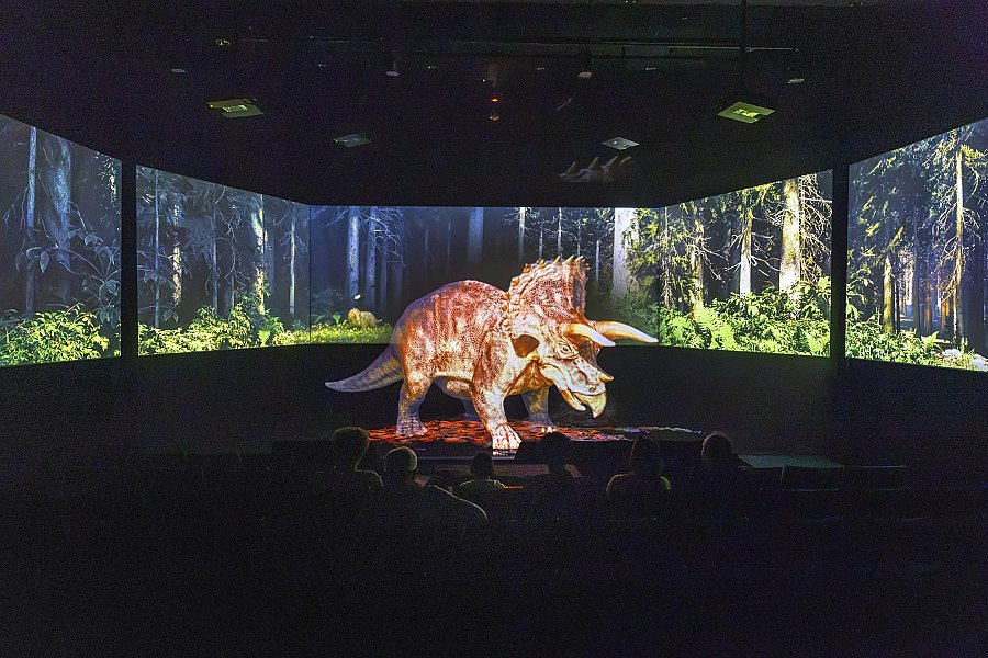 A triceratops appears in the Aquarium of the Pacific immersive HoloTheater.