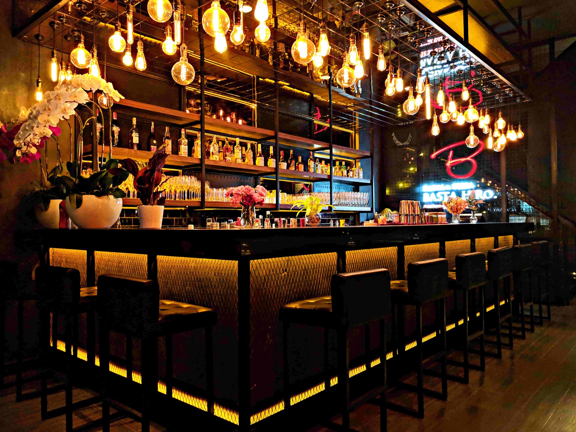 Interior of Stadium Bar & Lounge in Inglewood, with illuminated pendant lights above the bar.