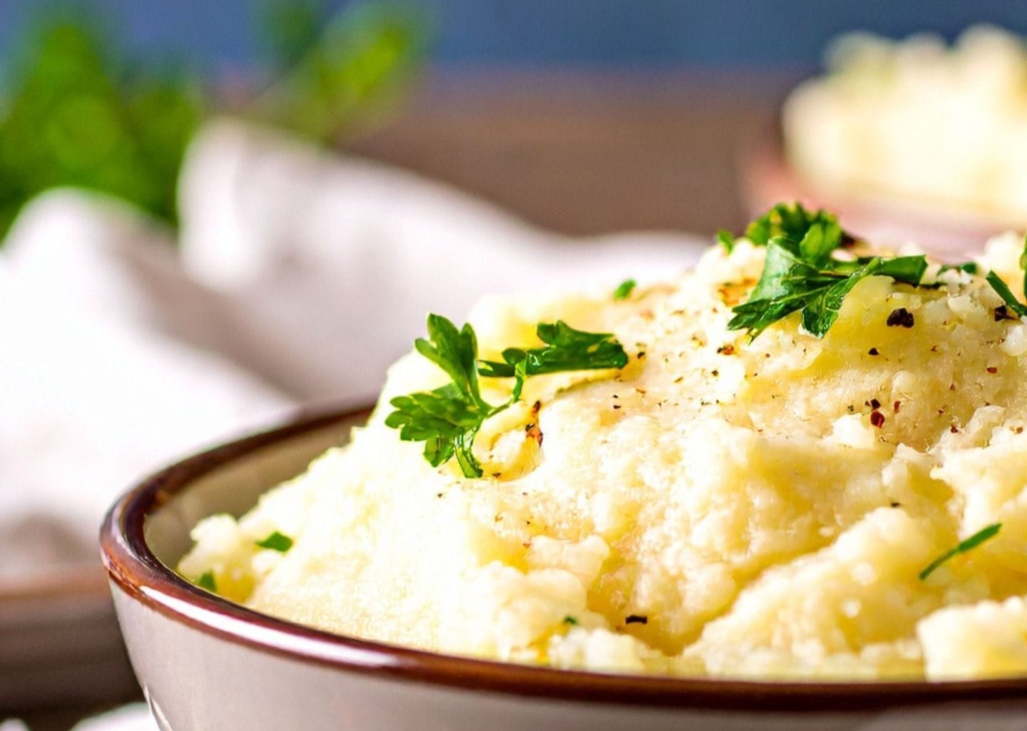 Juicy Ladies dish topped with green herbs in a bowl.