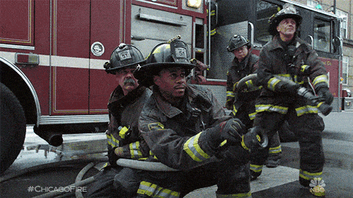 Firefighters beside a fire engine in the opening VIBES animation.