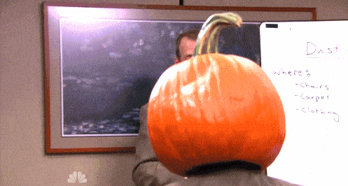 A character wears a carved pumpkin on his head in The Office Halloween animation.